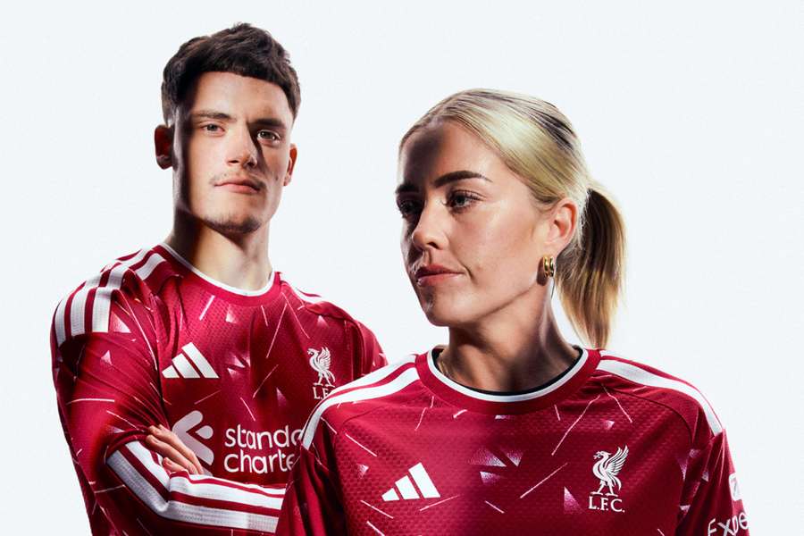 Florian Wirtz and Denise O'Sullivan model Liverpool's 2026/27 home kit Florian Wirtz and Denise O'Sullivan model Liverpool's 2026/27 home kit