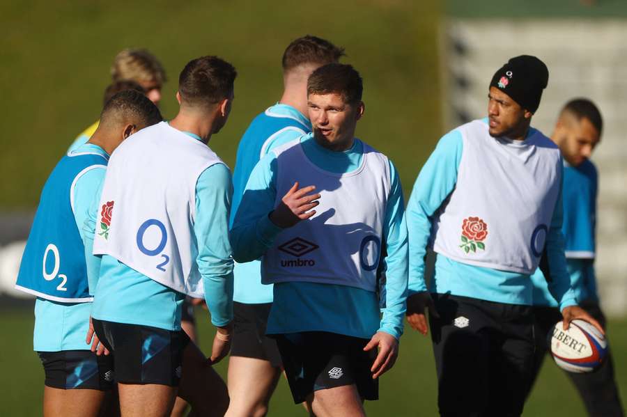 England's Owen Farrell with teammates during training