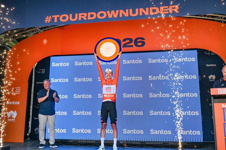 Jay Vine hoists the Tour Down Under trophy on Sunday. Jay Vine hoists the Tour Down Under trophy on Sunday.