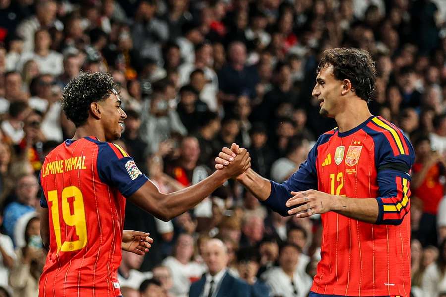 Spain's Lamine Yamal and Marc Pubill celebrate a goal
