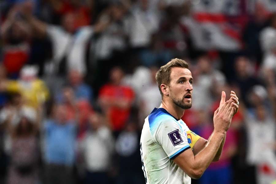 Harry Kane applauds supporters after his team beat Senegal in the last 16