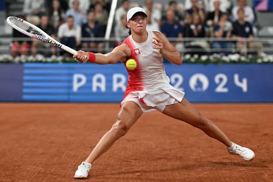 Poland's Iga Swiatek returns to Romania's Irina-Camelia Begu during their women's singles first round tennis match 