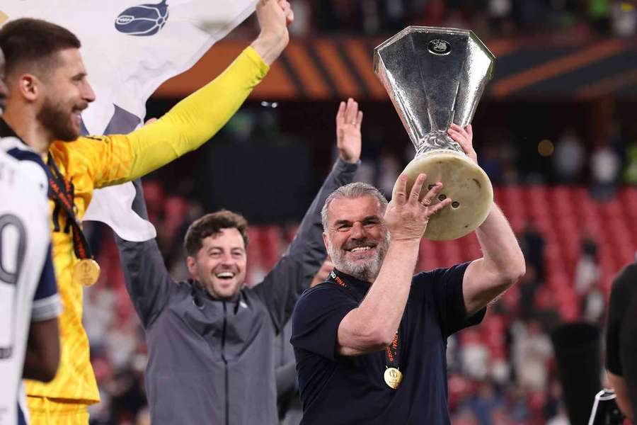 Tottenham head coach Ange Postecoglou with the Europa League trophy after beating Manchester United in the final.