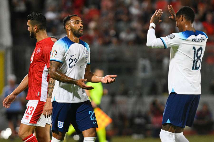 England forward Callum Wilson celebrates with Marcus Rashford (R) after scoring