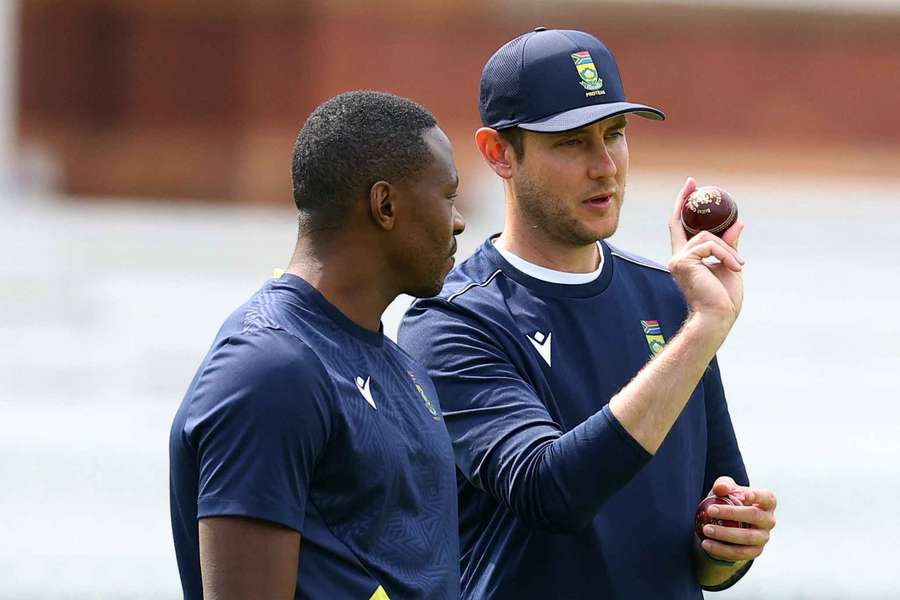 Kagiso Rabada listens to Stuart Broad at Lord's