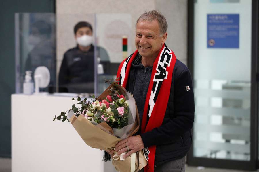 South Korean national soccer team's new head coach Juergen Klinsmann arrives at Incheon International Airport in Incheon, South Korea
