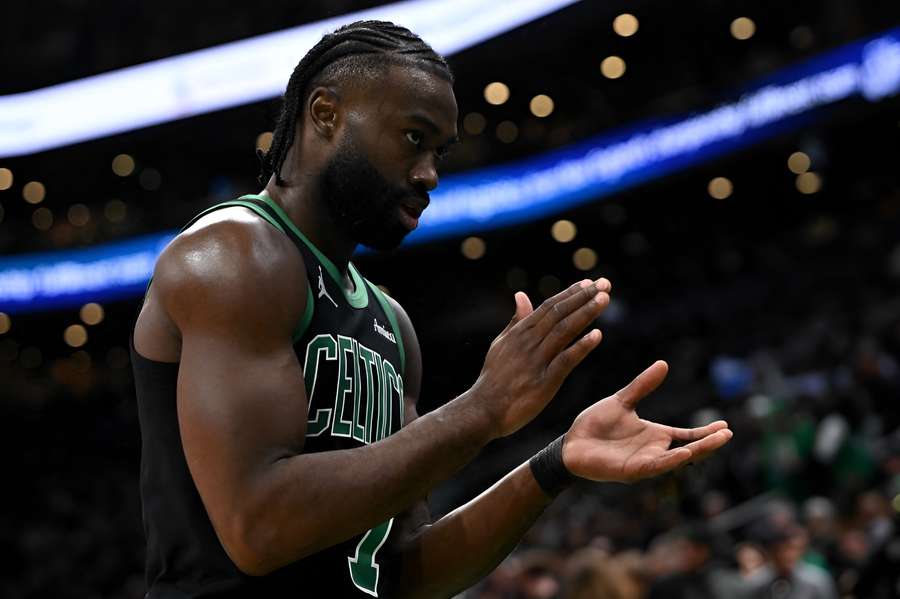 Jaylen Brown clapping after a close win over the Miami Heat