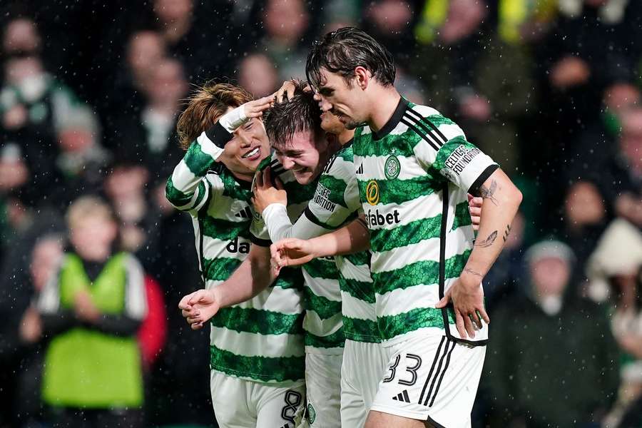 Celtic's Daniel Kelly (centre) celebrates scoring their side's seventh goal