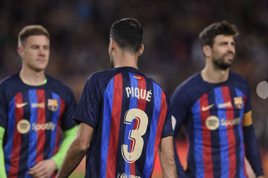 Busquets wearing a shirt with Pique's name and number