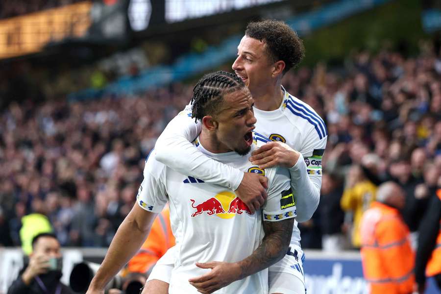 Noah Okafor of Leeds United celebrates scoring his team's third goal with teammate Ethan Ampadu