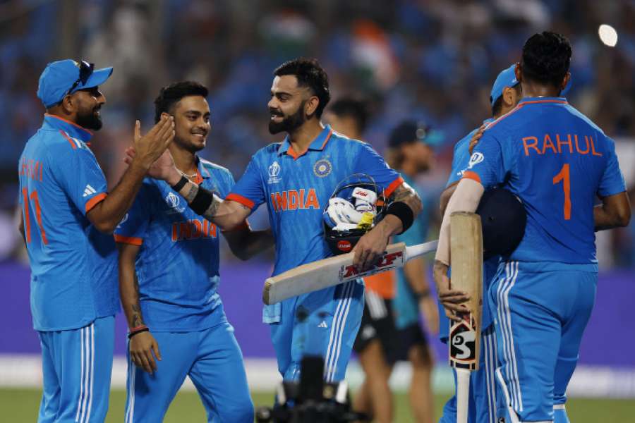 Kohli and teammates celebrate the win