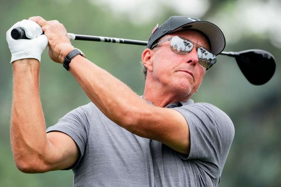 Mickelson tees off on the 18th hole during a practice round for The Masters