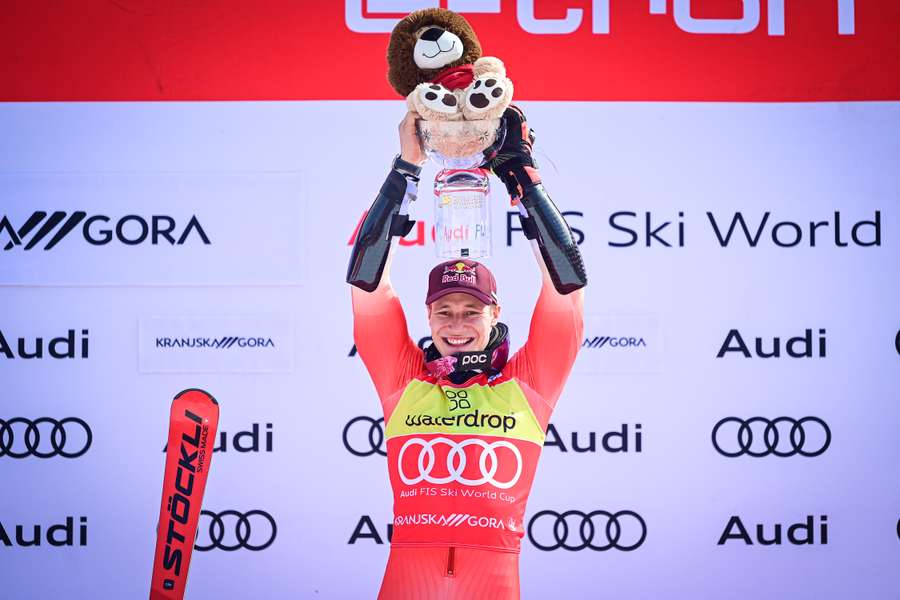 Switzerland's Marco Odermatt reacts on the podium after winning the FIS Alpine Skiing World Cup Giant Slalom race in Kranjska Gora, Slovenia