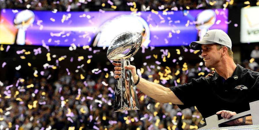 Baltimore Ravens head coach John Harbaugh holds the Vince Lombardi Trophy after the team's Super Bowl XLVII win Baltimore Ravens head coach John Harbaugh holds the Vince Lombardi Trophy after the team's Super Bowl XLVII win
