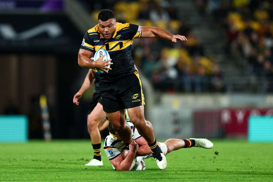 Hurricanes prop Pasilio Tosi is tackled by a Highlanders player at the weekend.