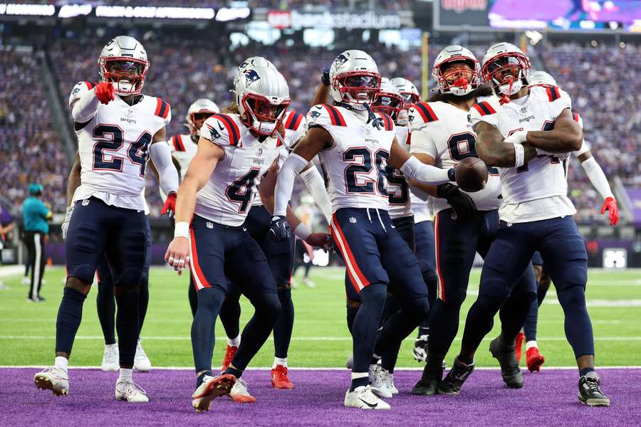 New England Patriots celebrate after an interception New England Patriots celebrate after an interception