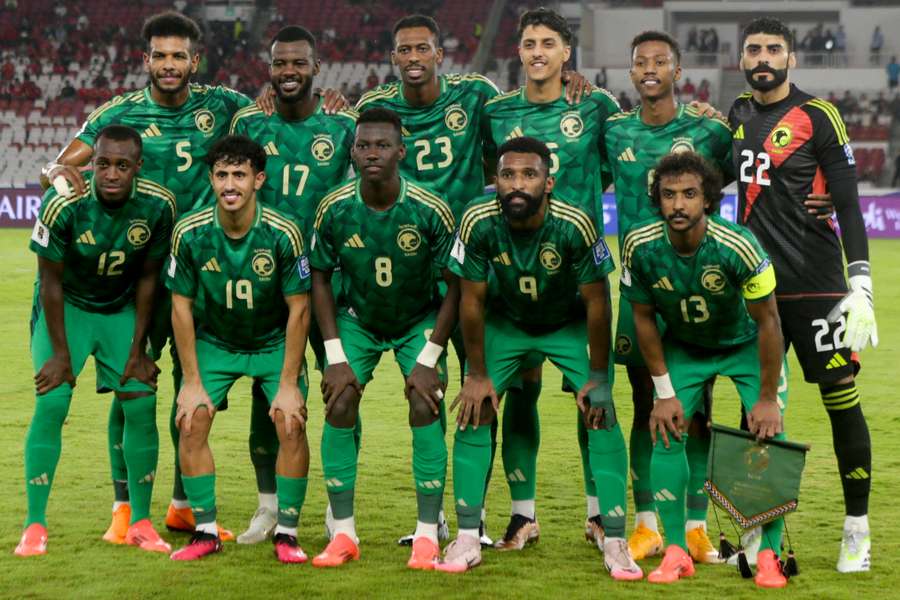 Saudi Arabia pose for a team photo at the start of 2026 World Cup Asian qualification match against Indonesia