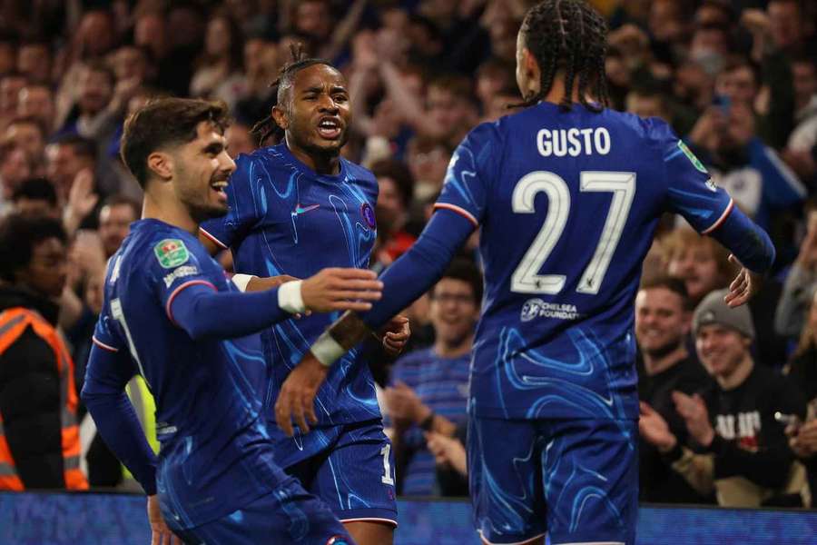 Nkunku celebrates with his Chelsea teammates