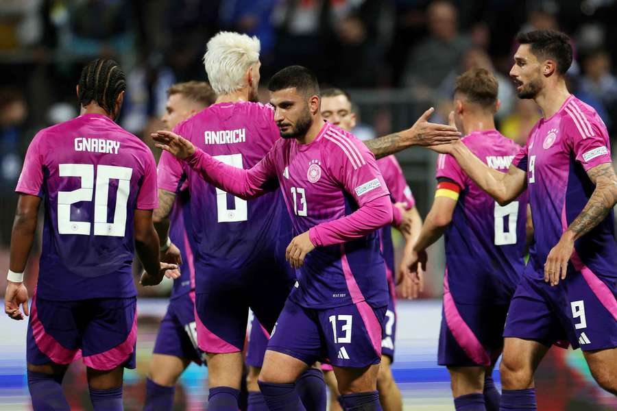 The German players celebrate Deniz Undav's second goal