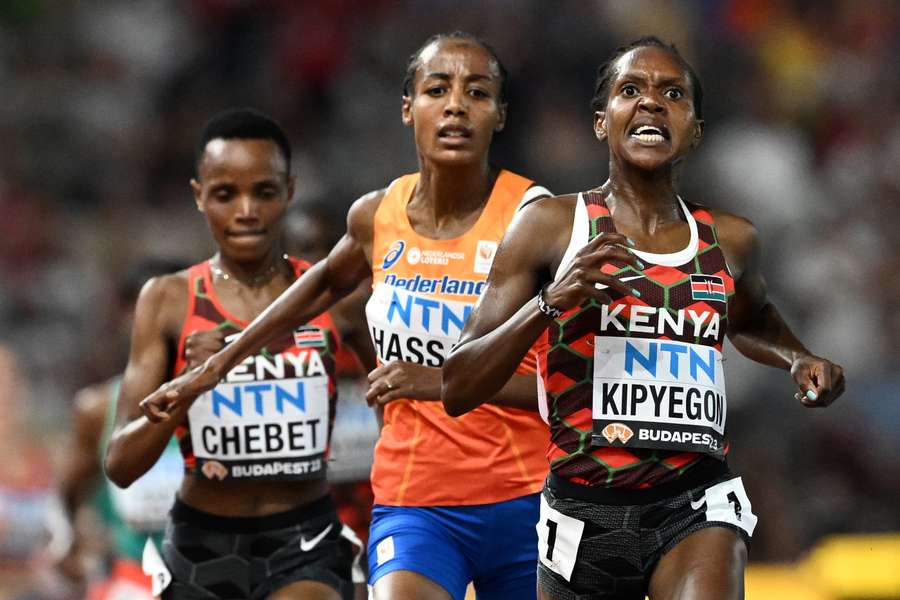 Kenya's Faith Kipyegon, Netherlands' Sifan Hassan, and Kenya's Beatrice Chebet react as they cross the finish line