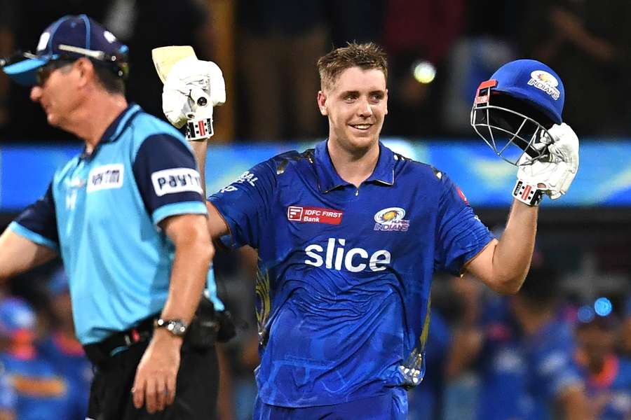Mumbai Indians' Cameron Green celebrates after scoring a century