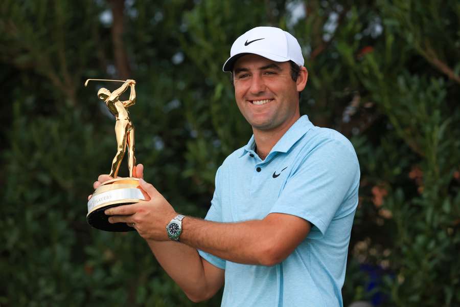 Scottie Scheffler of the United States celebrates with the trophy after winning during the final round of The Players Championship