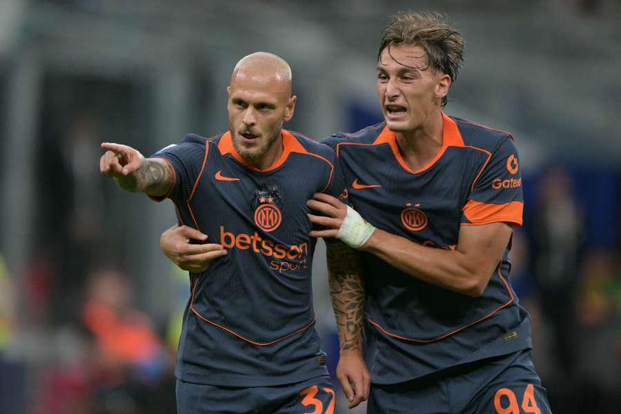 Inter Milan's Federico Dimarco (left) celebrates scoring his team's first goal with Pio Esposito