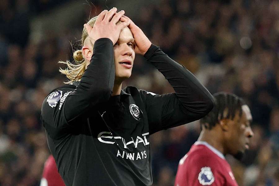 Erling Haaland reacts after missing a chance to score 