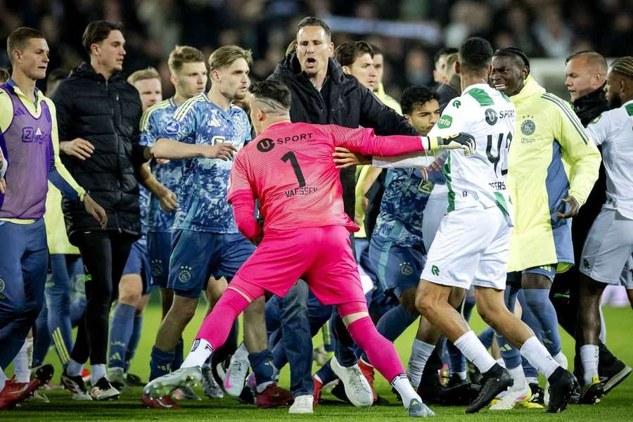 Etienne Vaessen (#1) gets into a scuffle with Ajax players and staffers