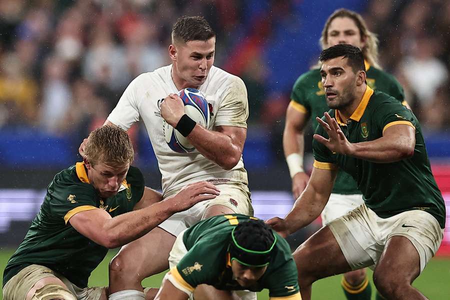 England's full-back Freddie Steward (2nd L) is tackled by South Africa's openside flanker Pieter-Steph du Toit