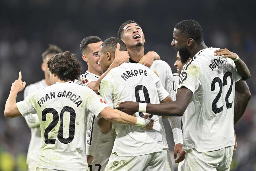 Kylian Mbappe (C) of Real Madrid celebrates his goal with his teammates