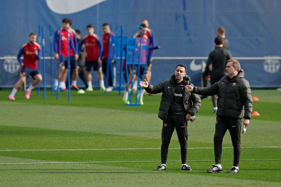 Xavi, left, during Barcelona training