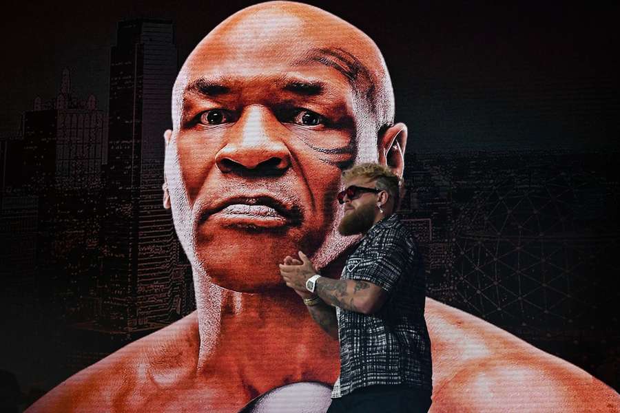 Paul walks onto a stage with Tyson as the backdrop