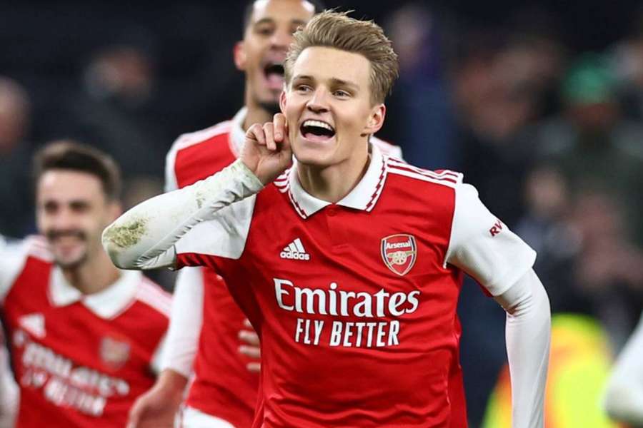 Odegaard celebrates with teammates after scoring against Tottenham