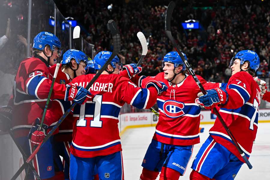 Canadiens celebrate their overtime goal against Rangers