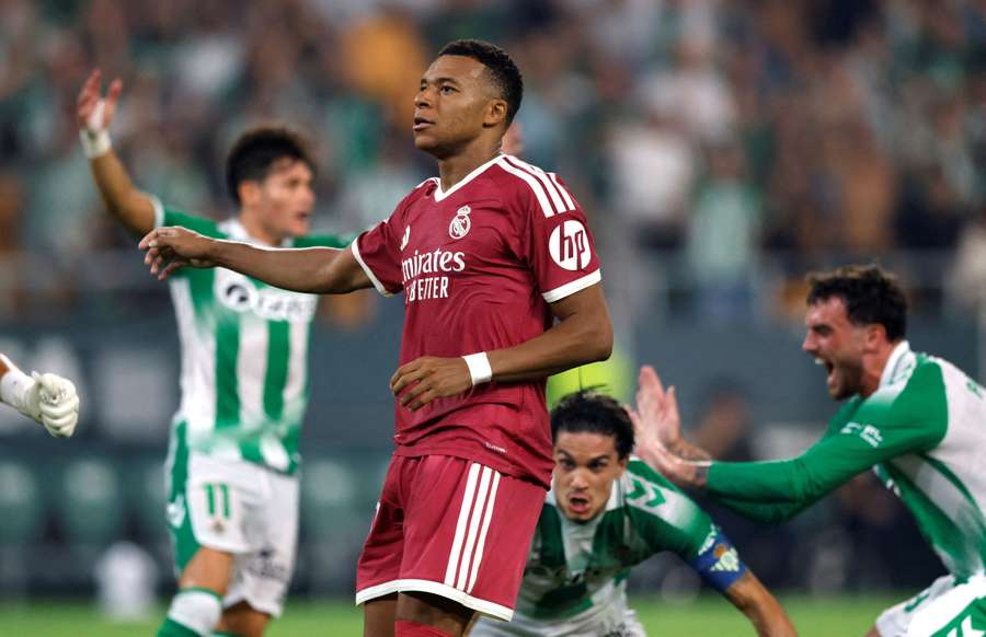 Kylian Mbappe looks dejected after his penalty is saved by Betis' Alvaro Valles