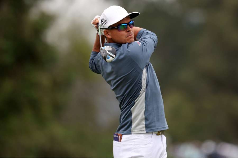 Rickie Fowler hits a tee shot on the 8th hole during the first round of the US Open