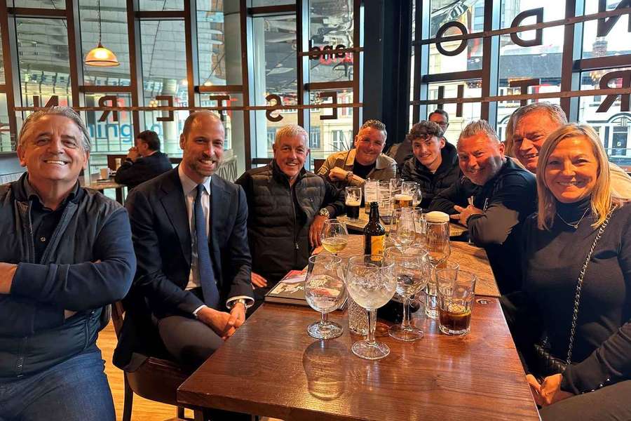 Prince William with pub patrons