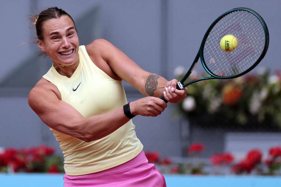 Aryna Sabalenka returns the ball to Magda Linette during her second-round Madrid Open victory on Friday