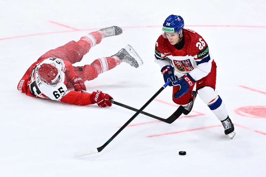 Jiří Ticháček skates away from Denmark's Christian Wejse