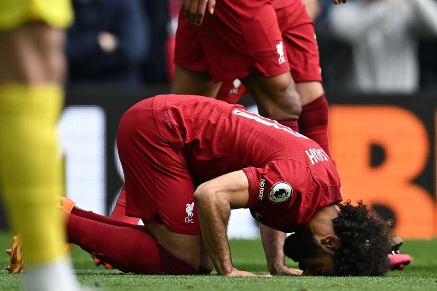 Liverpool's Egyptian striker Mohamed Salah celebrates after scoring their third goal from the penalty spot