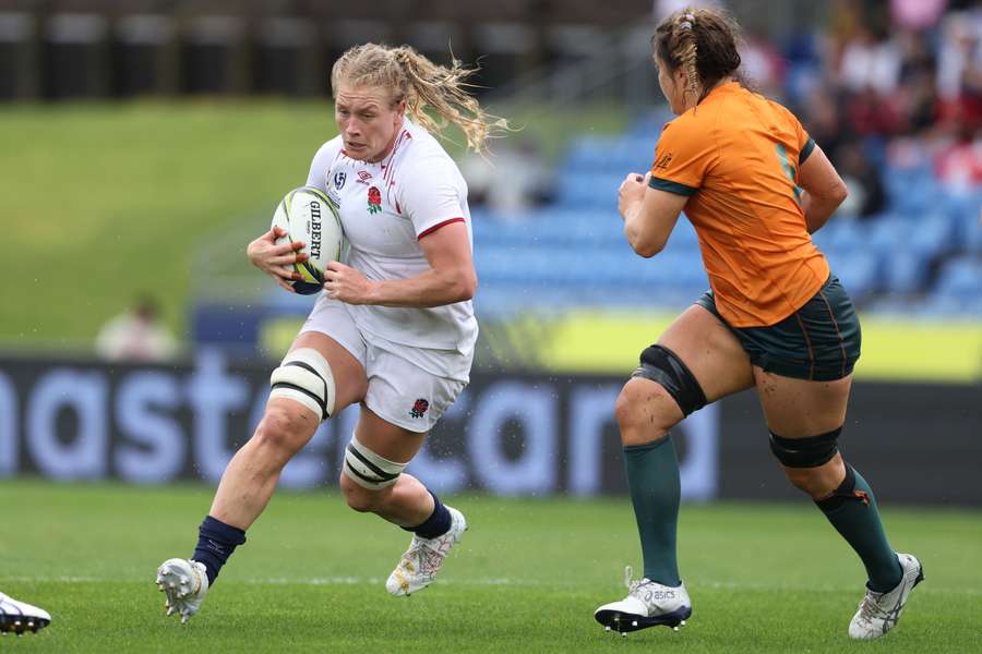 England's Alex Matthews is tackled during the quarter-final match against Australia