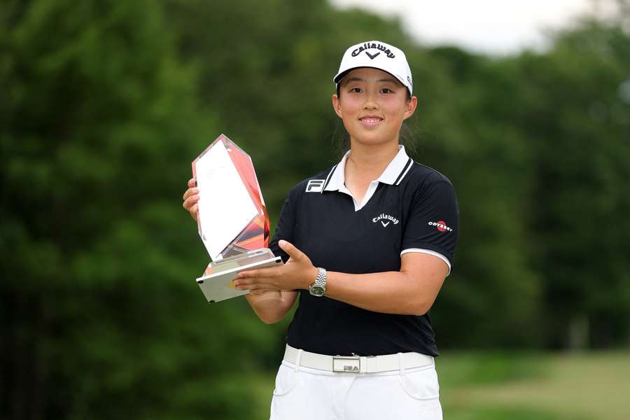 Ruoning Yin poses with 2026 FM Championship trophy Ruoning Yin poses with 2026 FM Championship trophy