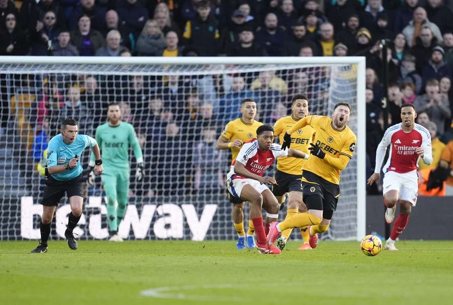 Lewis-Skelly fouls Doherty