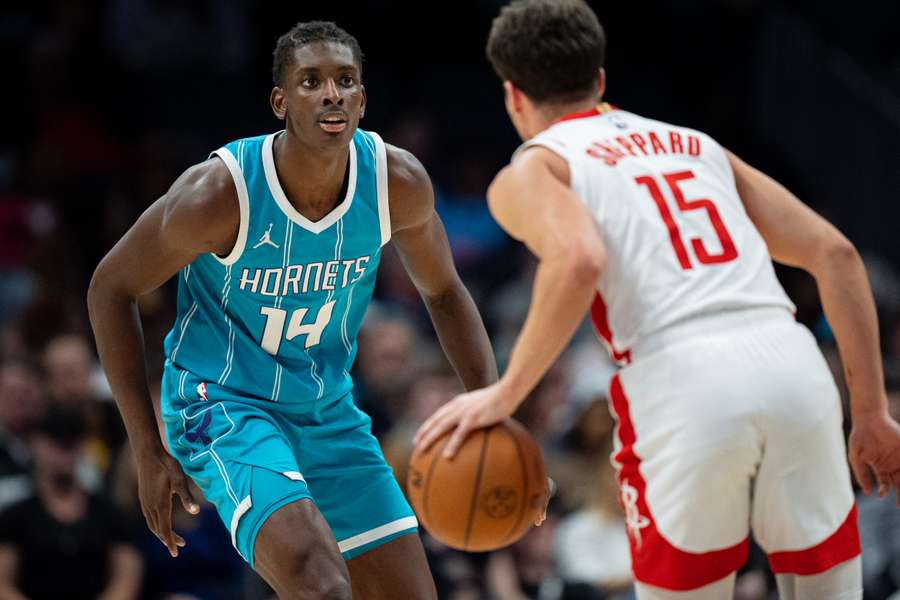Charlotte Hornets forward Moussa Diabate guarding Houston Rockets' Reed Sheppard (December 2024)