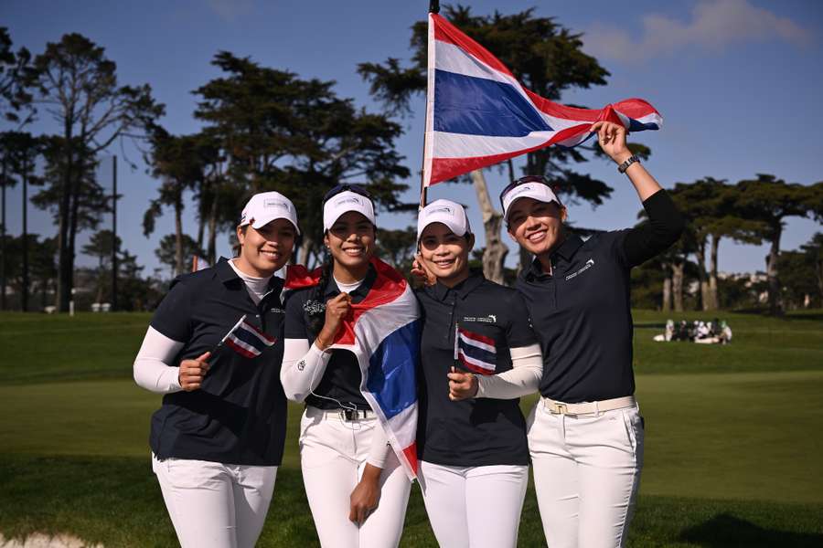 Thailand's team pose after their victory