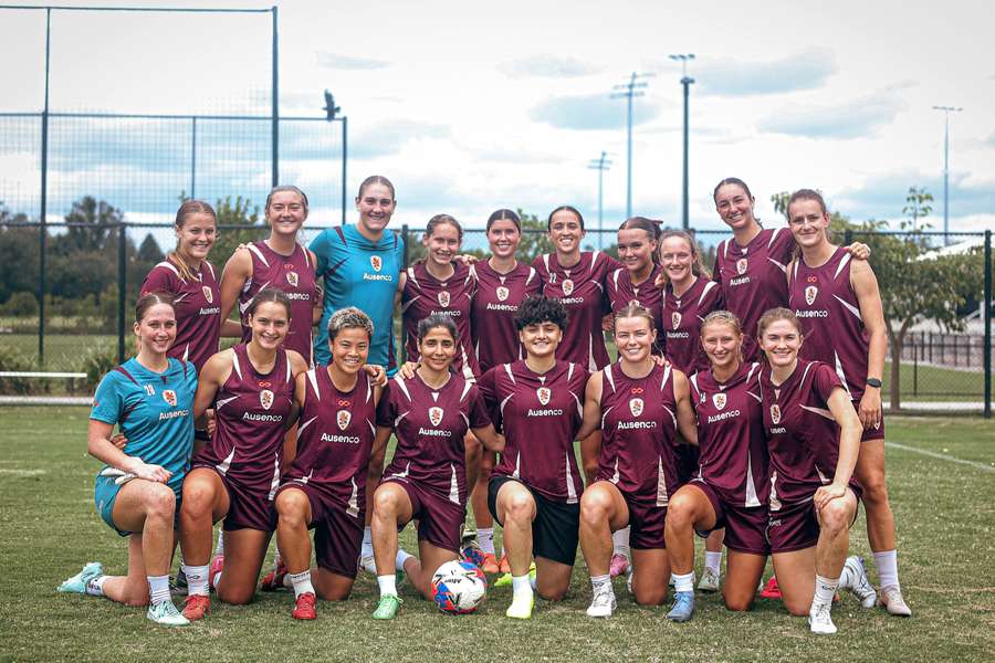Fatemeh Pasandideh and Atefeh Ramezanisadeh (front row, middle) are photographed with Brisbane Roar's A-League Women's team.
