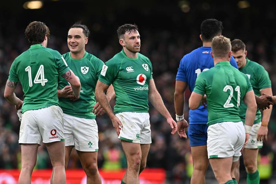 Ireland's players react to their victory on the final whistle in the Six Nations international rugby union match between Ireland and France