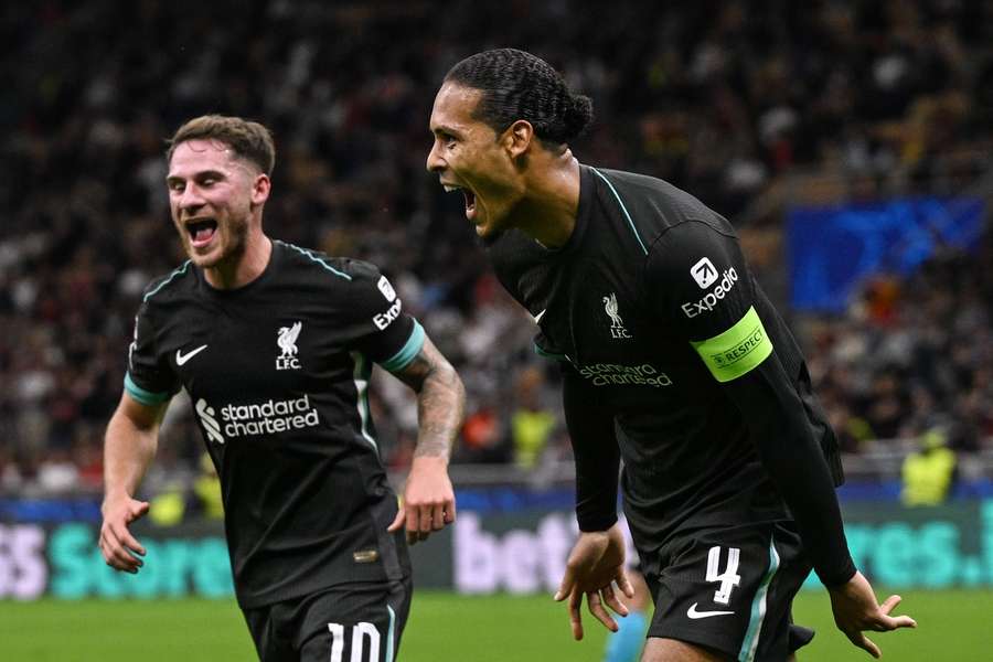 Liverpool defender Virgil van Dijk celebrates scoring against AC Milan