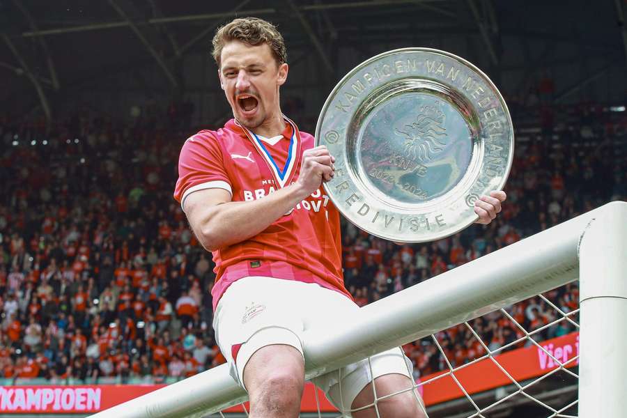 PSV's Olivier Boscagli holding the Eredivisie trophy after last season's title